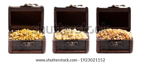 Gold Frankincense and Myrrh in three Chests Isolated on a White Background Royalty-Free Stock Photo #1923021152