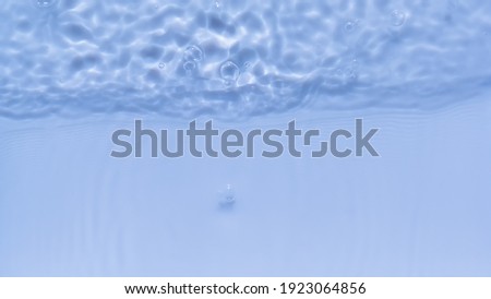 Cleanliness and freshness. Photo of water waves shadow on pool bottom. Subtle texture of light-shadow pattern of sunlight reflection from rippled water surface with bubble. Beautiful natural wallpaper