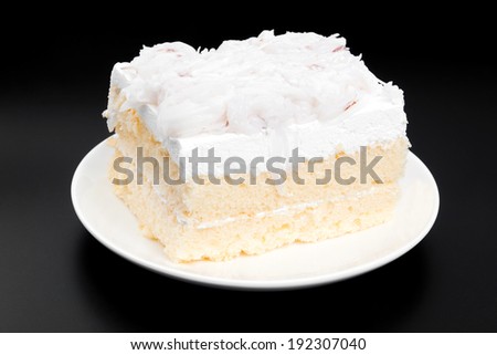 Coconut cake on black background