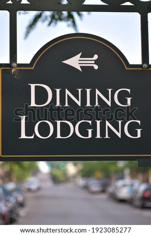 signage for Dining and Lodging with an arrow pointing in Direction