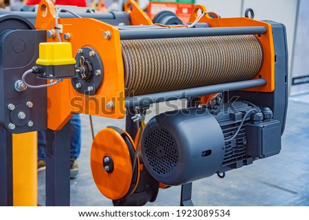 Suspension Crane Winch with Iron Rope. Royalty-Free Stock Photo #1923089534