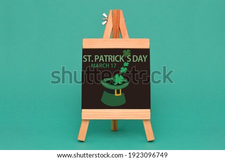 St. Patrick's Day March 17 blackboard sign with hat and four leaf clovers