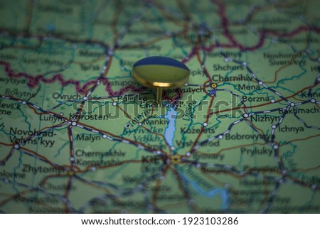 Chernobyl pinned on a map with flag of Ukraine Royalty-Free Stock Photo #1923103286