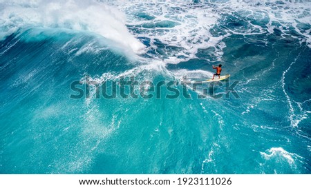 Rear View of a Surfer Riding a Fantastic Wave at Sunset Beach, Hawaii Royalty-Free Stock Photo #1923111026