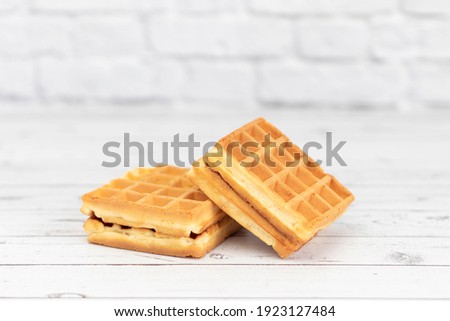 Belgian waffles close up isolated on white background. Delicious, fresh baked goods