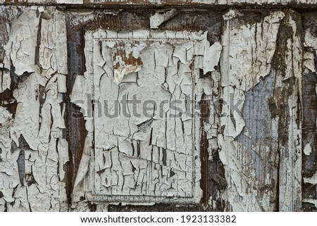 texture of an old gray wall from a wooden board with white shabby paint