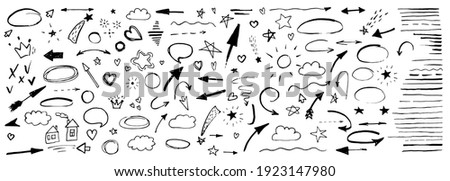 Hand drawn doodle design elements, black on white background. Swishes, swoops, emphasis, Arrow, crown, brush stroke. doodle sketch design elements Royalty-Free Stock Photo #1923147980