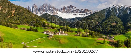Beautiful panoramic landscape of Italian dolomites. Santa Maddalena village with church and mountains in background. Val di Funes valley, Trentino Alto Adige region, Italy Royalty-Free Stock Photo #1923150269