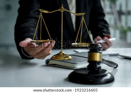 Attorneys or judges sitting at work to sign important documents, attorneys and law, legal concepts of the judiciary and the legislature.