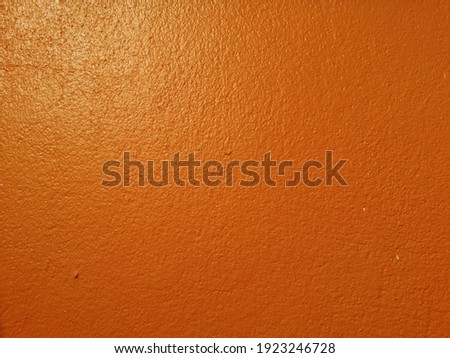 orange Rust​y​ damaged​ to​ surface​ wall​ for​ background. Wall​ texture​ for​ vintage​ background.