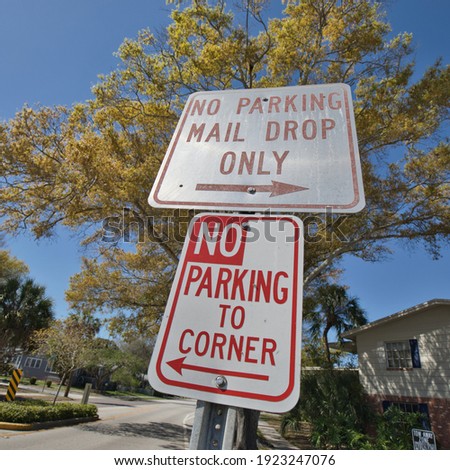 "No Parking Mail Drop Only" and "No Parking To Corner' sign in Florida.