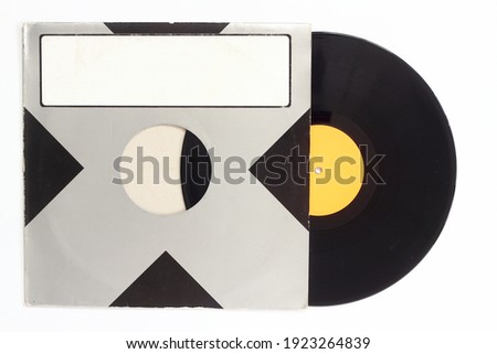 Aged black paper cover and vinyl LP record isolated on white background