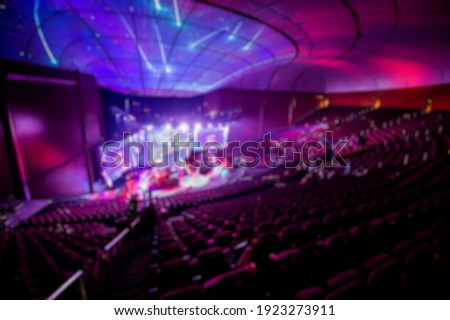 Abstract blurred background of big esports gaming event at big arena. Royalty-Free Stock Photo #1923273911