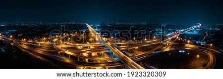 Expressway top view, Road traffic an important infrastructure in Thailand. Road and Roundabout, multilevel junction motorway, Panorama Aerial view Royalty-Free Stock Photo #1923320309