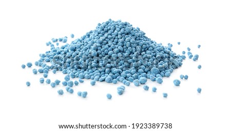 Pile of granular mineral fertilizer isolated on white Royalty-Free Stock Photo #1923389738