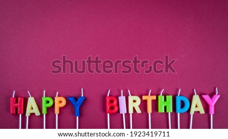 HAPPY BIRTHDAY. Anniversary candles on a red background. Horizontal banner.