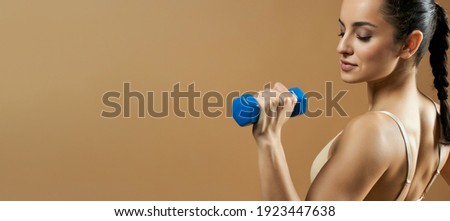 Website header of Beautiful young woman doing exercise with dumbbell