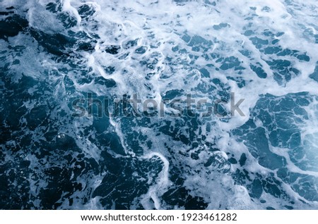 Sea water top view. Abstract natural blue wave splash background.