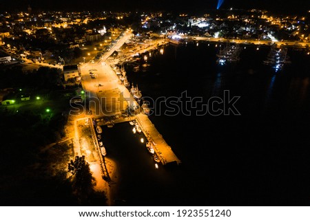 Night aerial view of marina in Jastarnia. Hel peninsula harbor in Puck Bay Baltic Sea Poland drone photo. Marina, harbor at night