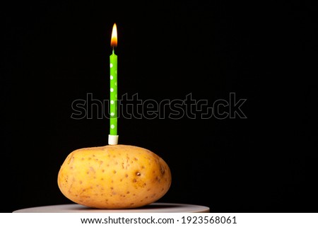 image of potato candle dark background