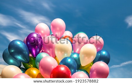 Lots of colorful balloons on the blue sky background with clouds Royalty-Free Stock Photo #1923578882