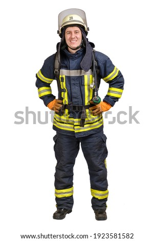 Full body young brave man in uniform and hardhat of firefighter looking at camera with smile isolated on white background