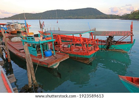 View of a typical cambodian long-tale boat anchored on the pier near Sihanoukville. This boat is used for the touristic transfer from the mainland to the touristic island of Koh Rong and Koh Rong Sanl