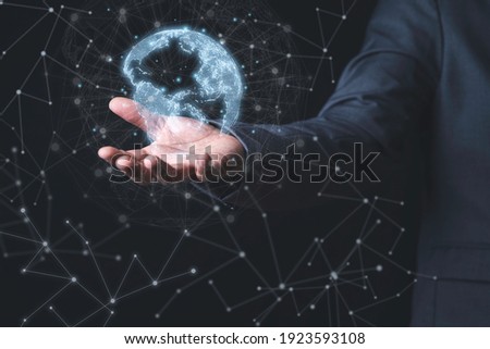 Businessman holding virtual world with connection line for global networks and technology linkage concept. Royalty-Free Stock Photo #1923593108