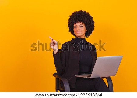 afro business woman working online with laptop computer. 