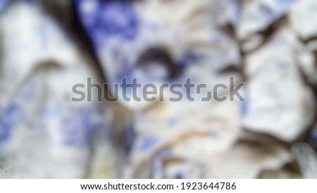 Tie Dye shirt with blue and white colors with blurred 