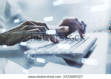 Multi exposure of abstract programming language hologram with hands typing on computer keyboard on background, artificial intelligence and machine learning concept