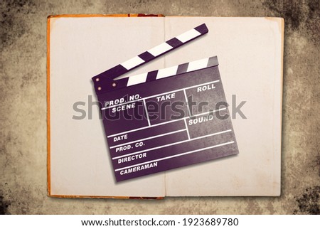 Movies adapted from books, cinema concept with clapboard and book