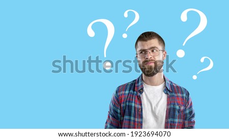 Question sign with a beautiful alarmed man on pastel background