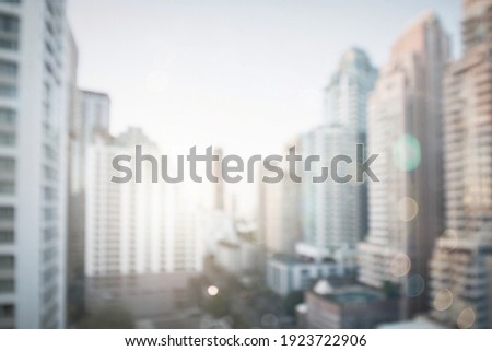 Abstract blur city estate building in morning view background. Cityscape skyline from top office window view. Blurred outside bokeh real architecture modern company construction town morning outdoor.