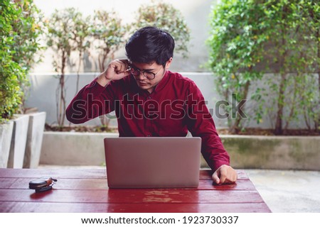 Men and laptops Sit and work at home Picture for your business