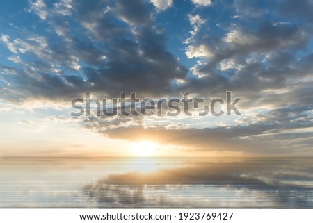 dramatical fluffy  clouds on sunset sea , sunlight  reflection on water wave 
