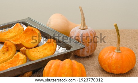 Baked pumpkin slices close up on baking pan, step by step pumpkin puree recipe, lifestyle