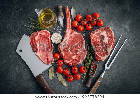 Fresh raw Prime Black Angus beef steaks. Variety of raw beef meat steaks for grilling. Royalty-Free Stock Photo #1923778391