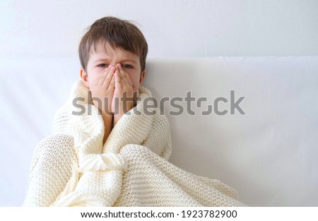 Ill cute preschool Boy With Flu At Home. Coughing Royalty-Free Stock Photo #1923782900