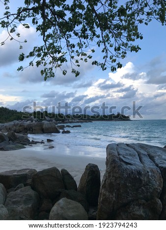 beach stones rock cloud ocean sea