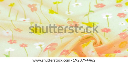 silk fabric, small flowers on a beige background, fine stitching. Floral design. Background texture