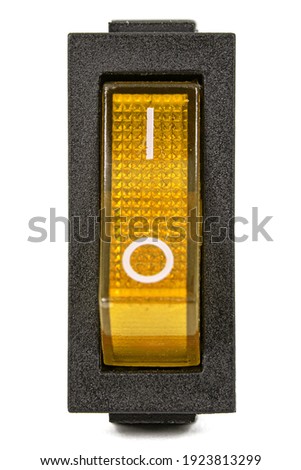 Yellow power switch at ON position, isolated on white background