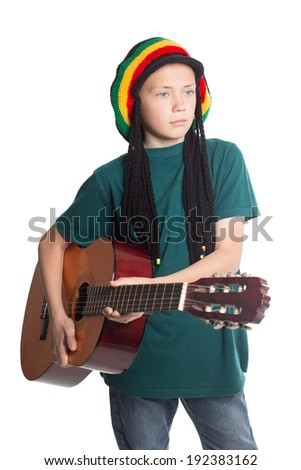 European boy with guitar and hat with artificial dreadlocks.