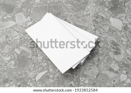 Business card on gray background.