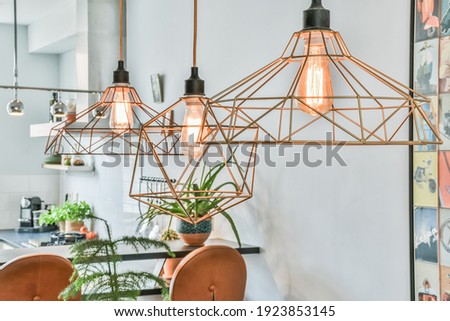 Chandelier with LED lamps in a modern house. Interior design of a new apartment Royalty-Free Stock Photo #1923853145