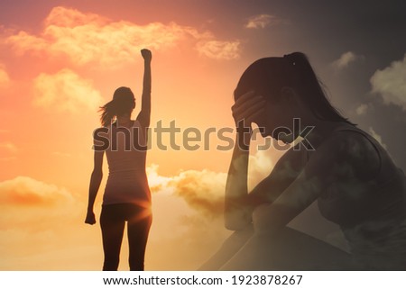 Young woman feeling happy and free overcoming mental fears and life's problems.  Royalty-Free Stock Photo #1923878267