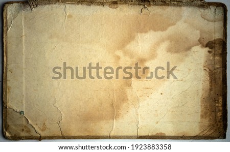 The texture of a vintage cardboard book cover with damage Royalty-Free Stock Photo #1923883358