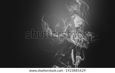 Cigarette smoke in the dark room healthcare concept.