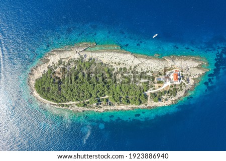 Aerial overhead drone shot of Host Island in Adriatic sea near Vis Island in Croatia summer