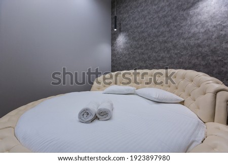 Interior photography, modern bedroom, loft style with large bed
